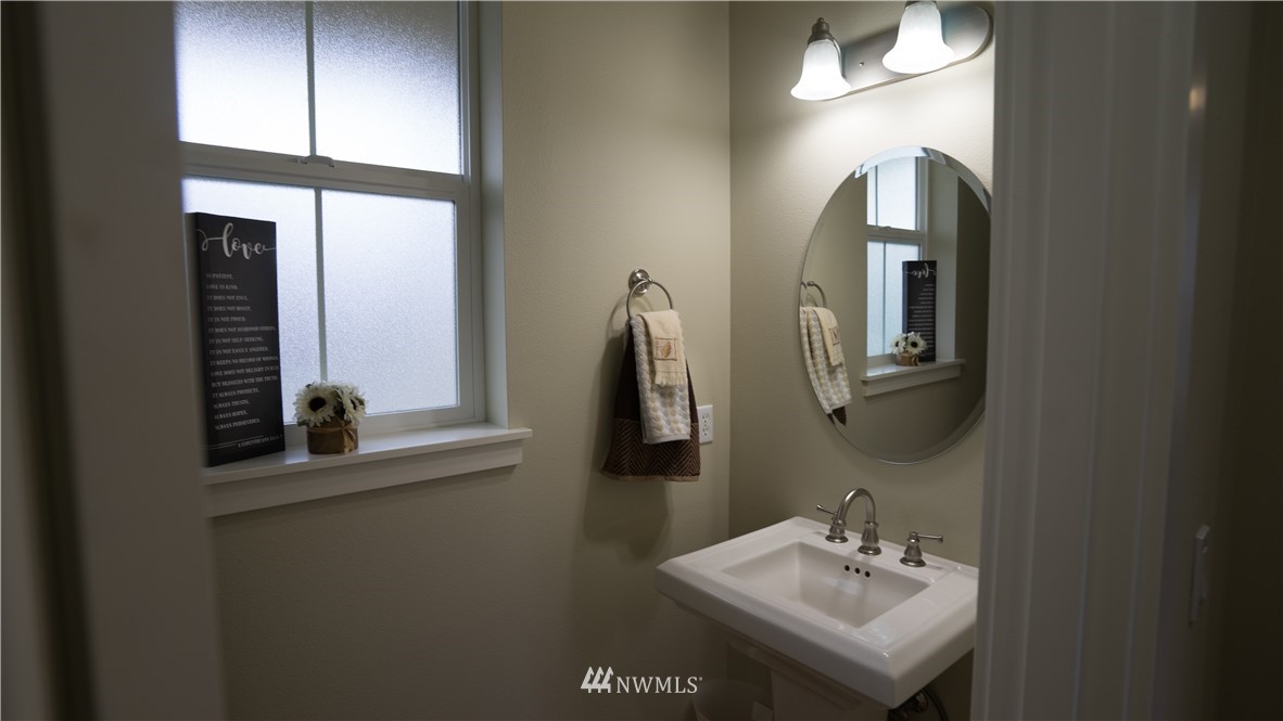 662 Lyons Avenue Northeast Renton, WA 98059 - Photo 6 of 28 a bathroom with a sink and a mirror