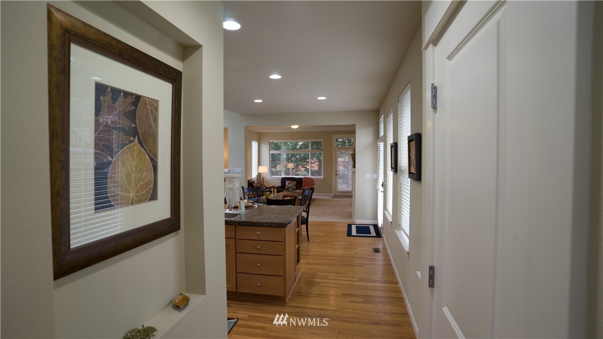 662 Lyons Avenue Northeast Renton, WA 98059 - Photo 7 of 28 a living room with furniture and a painting on the wall