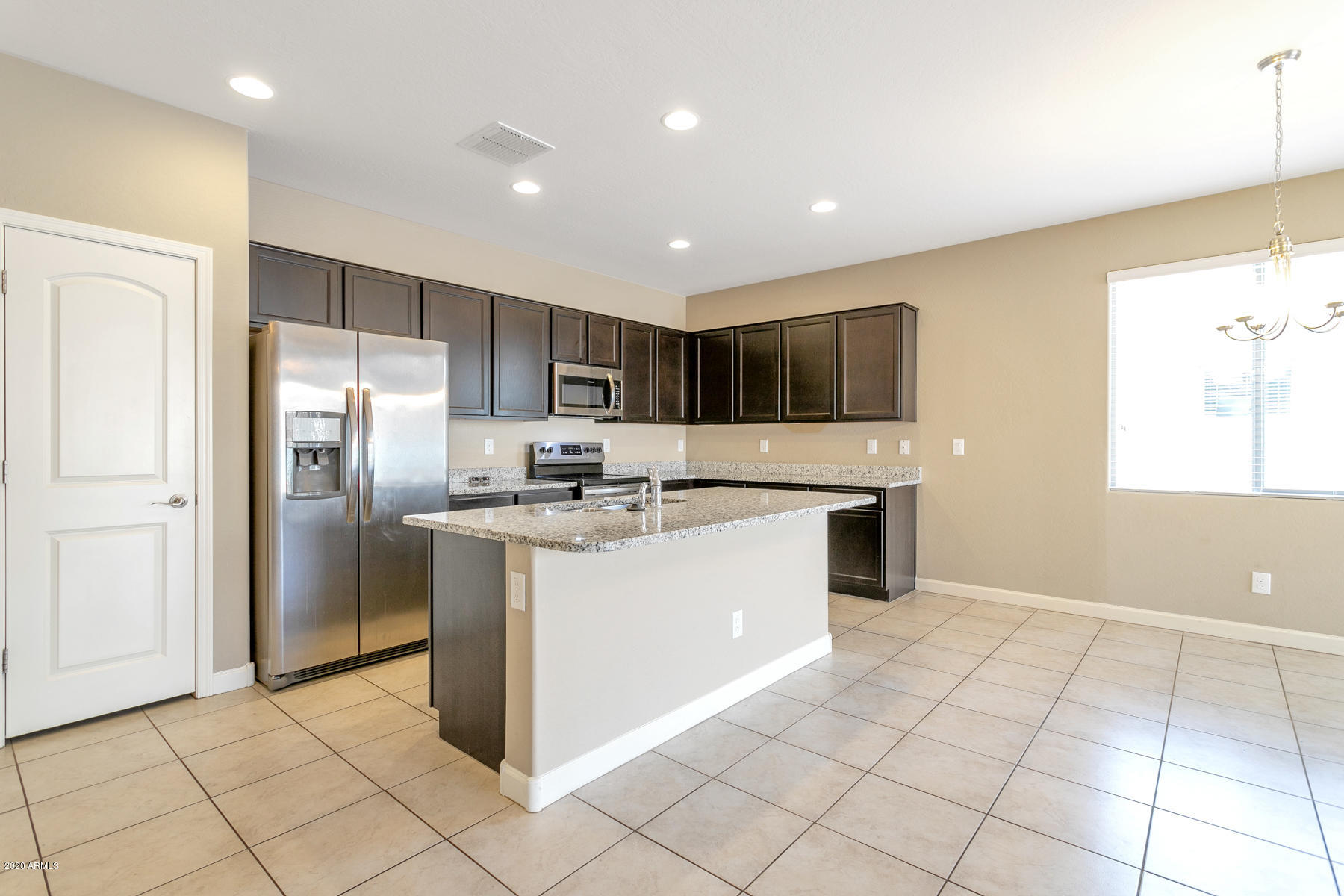 23770 West Ripple Road Buckeye, AZ 85326 - Photo 4 of 15 Granite Countertops and Stainless Steel