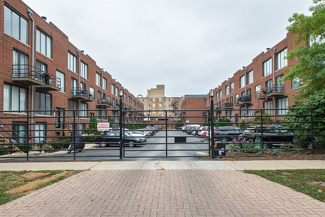 944 West Grace Street, Unit E202 Chicago, IL 60613 - Photo 1 of 10 a view of building with street view