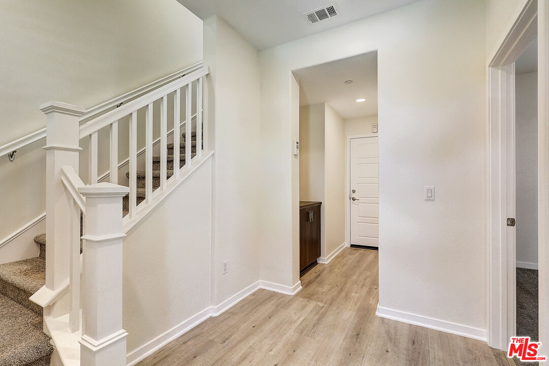 202 Paramount Irvine, CA 92618 - Photo 12 of 32 a view of an entryway with wooden floor