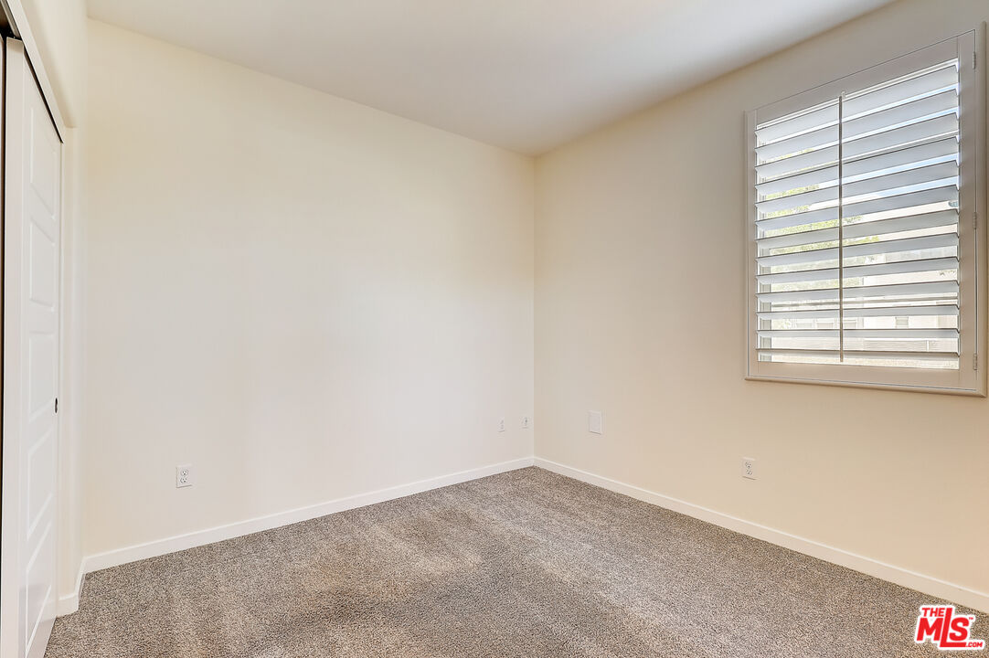 202 Paramount Irvine, CA 92618 - Photo 14 of 32 an empty room with a window