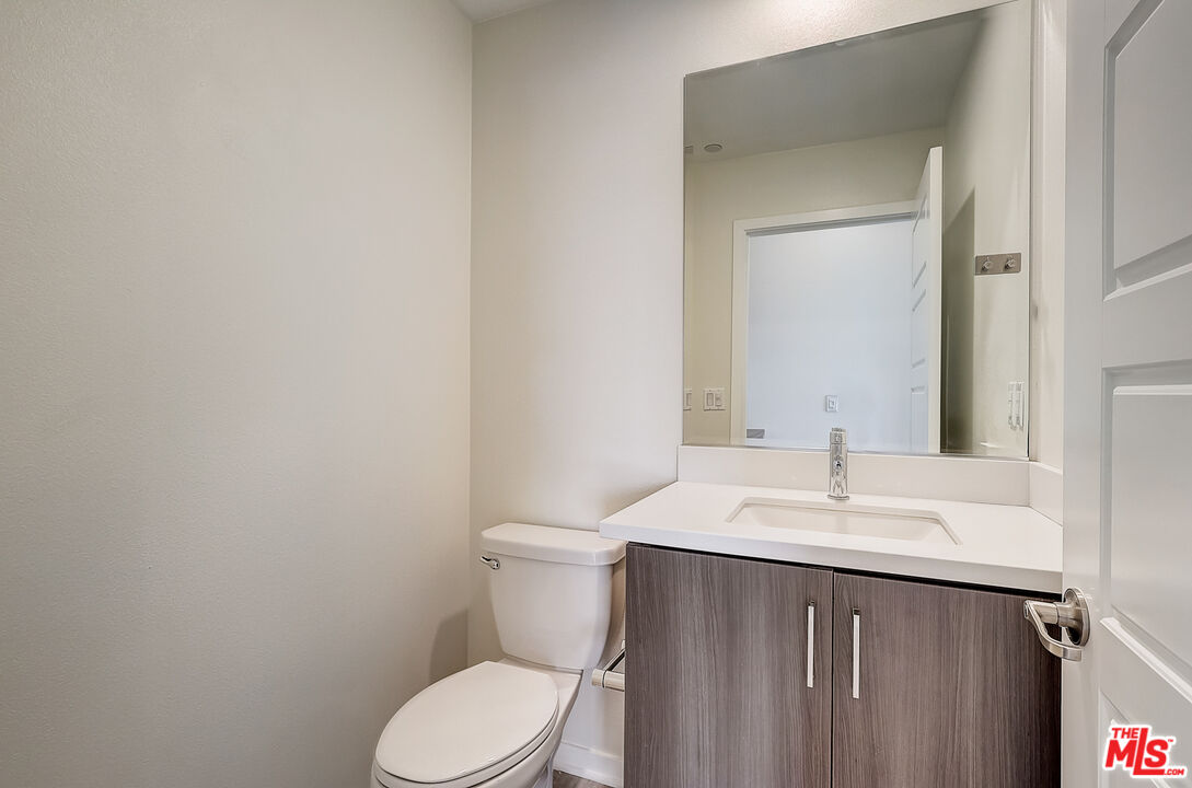 202 Paramount Irvine, CA 92618 - Photo 20 of 32 a bathroom with a sink and a toilet