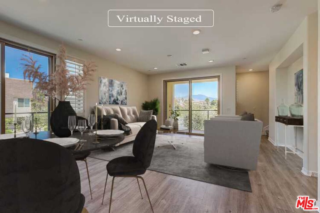 202 Paramount Irvine, CA 92618 - Photo 2 of 32 a living room with furniture and a large window