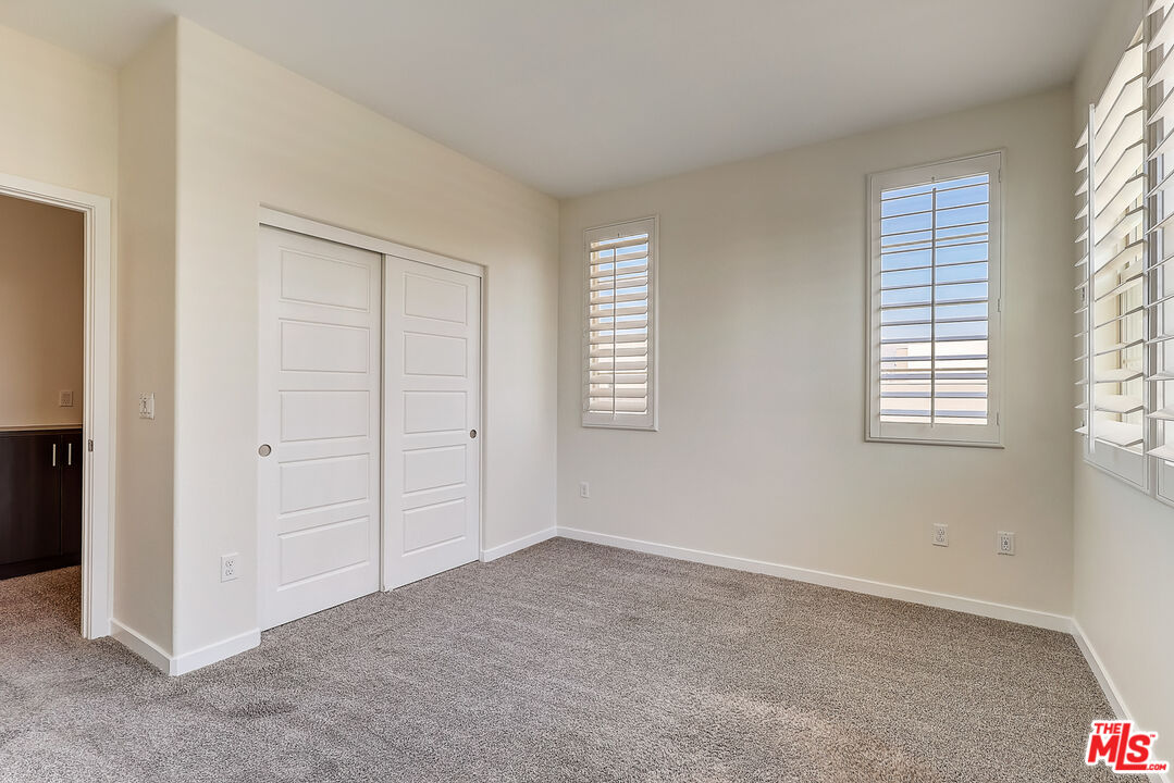 202 Paramount Irvine, CA 92618 - Photo 25 of 32 an empty room with windows