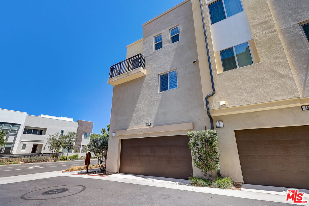 202 Paramount Irvine, CA 92618 - Photo 31 of 32 a front view of a building with garage