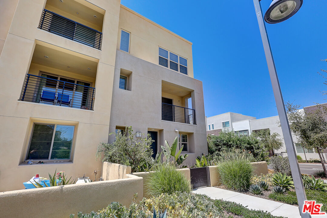 202 Paramount Irvine, CA 92618 - Photo 10 of 32 a view of a building with a window and yard
