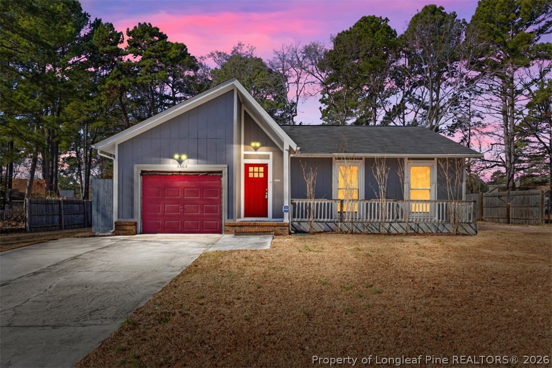 3305 Hunting Bay Drive Spring Lake, NC 28390 - Photo 1 of 27 a view of a house with a yard and garage