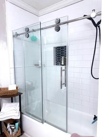 a bathroom with a shower and a tub