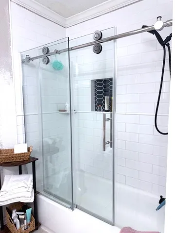 a bathroom with a shower and a tub