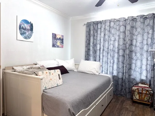 a bedroom with a bed and a couch