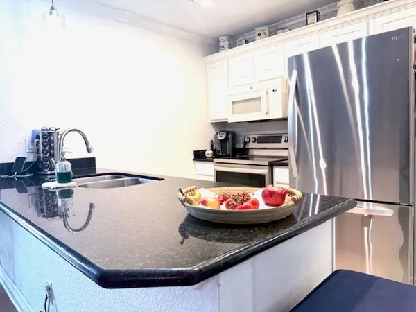 a kitchen with a sink and a stove