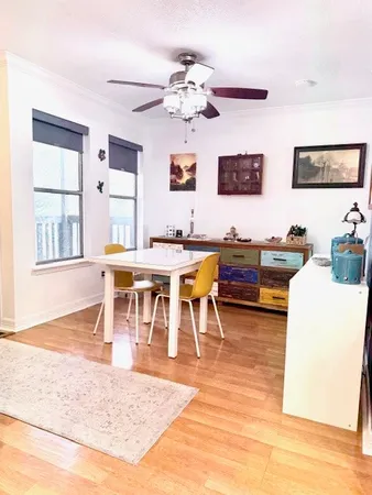 a view of a dining room with furniture and chandelier