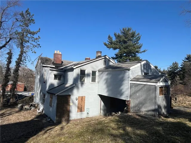 a view of a tree next to a yard