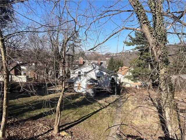 a backyard of a house with lots of green space