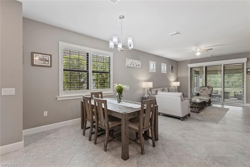 5825 Mayflower Way Ave Maria, FL 34142 - Photo 14 of 50 a view of a dining room with furniture window and outside view