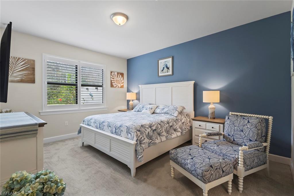 5825 Mayflower Way Ave Maria, FL 34142 - Photo 17 of 50 a bedroom with a bed and a window