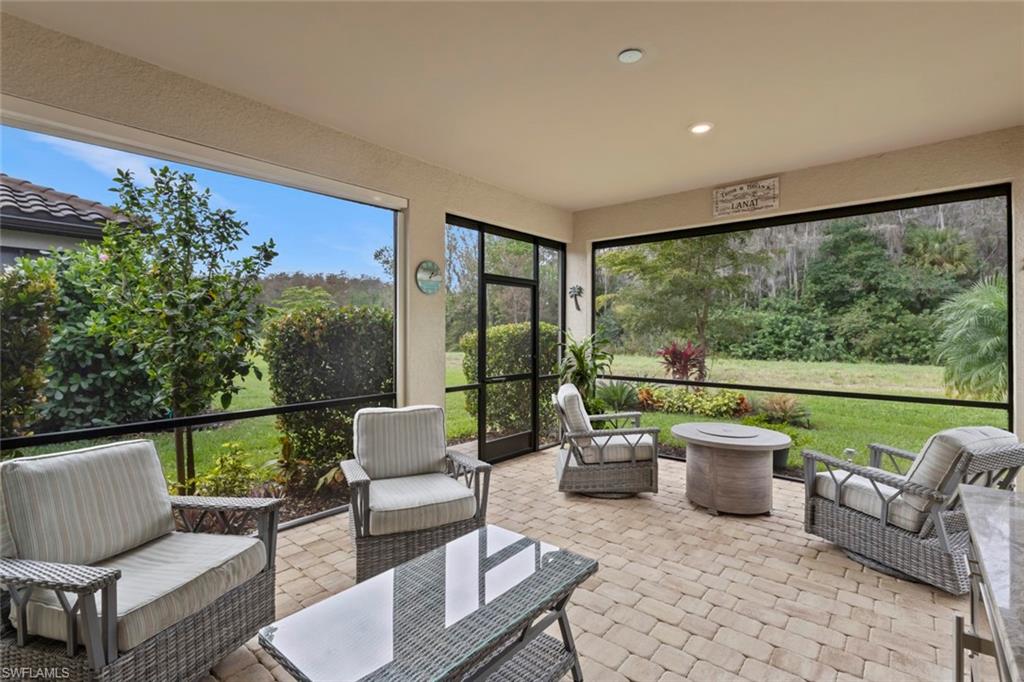 5825 Mayflower Way Ave Maria, FL 34142 - Photo 2 of 50 a outdoor living space with furniture and garden view