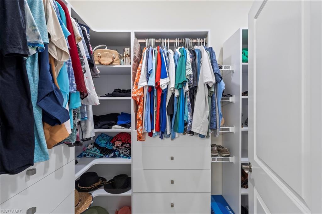 5825 Mayflower Way Ave Maria, FL 34142 - Photo 22 of 50 a view of walk in closet with clothes and shoes