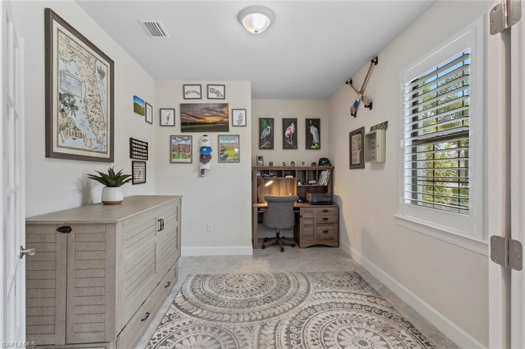 5825 Mayflower Way Ave Maria, FL 34142 - Photo 24 of 50 a living room with furniture and a window