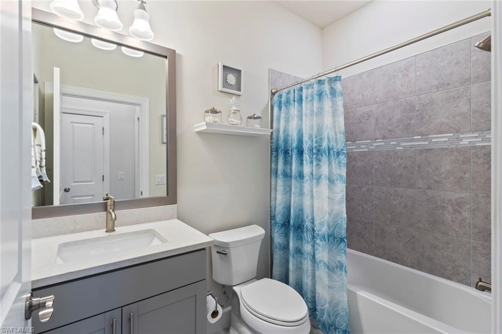 5825 Mayflower Way Ave Maria, FL 34142 - Photo 25 of 50 a bathroom with a sink a toilet and shower