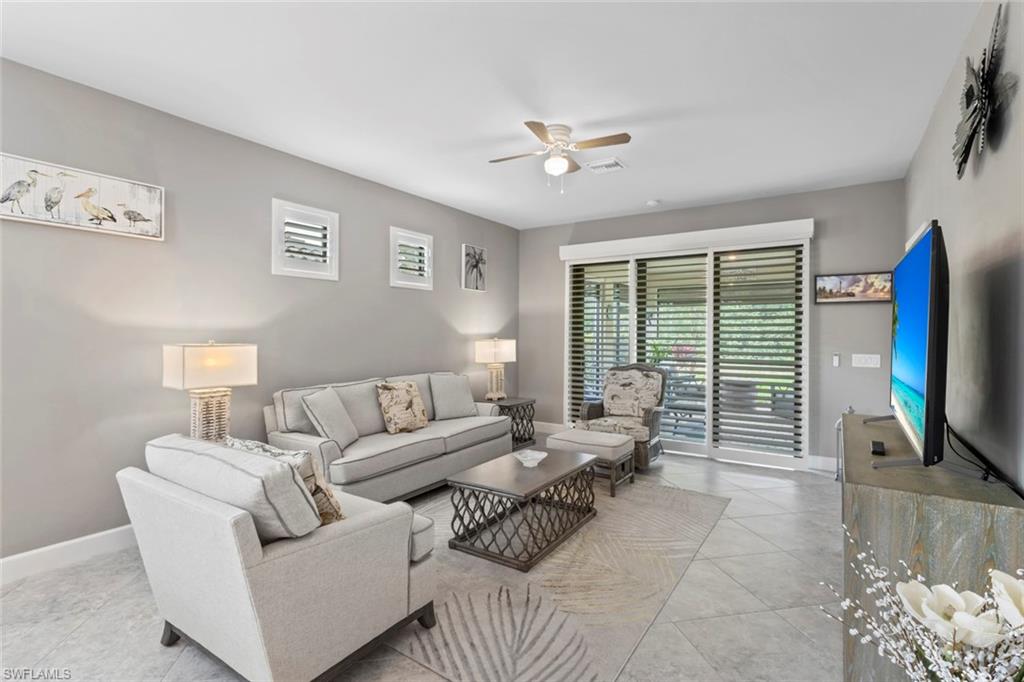5825 Mayflower Way Ave Maria, FL 34142 - Photo 6 of 50 a living room with furniture and a flat screen tv