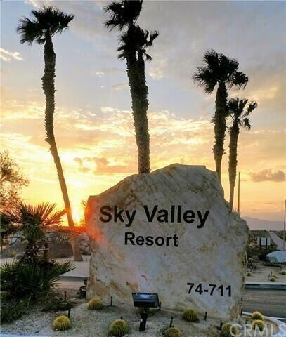 74711 Dillon Road, Unit 711 Desert Hot Springs, CA 92241 - Photo 15 of 35 a front view of a house with a sign board