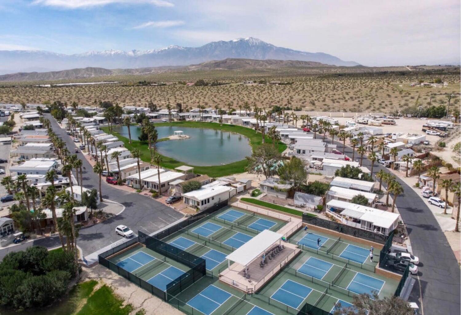 74711 Dillon Road, Unit 711 Desert Hot Springs, CA 92241 - Photo 29 of 35 an aerial view of residential houses with outdoor space and ocean view