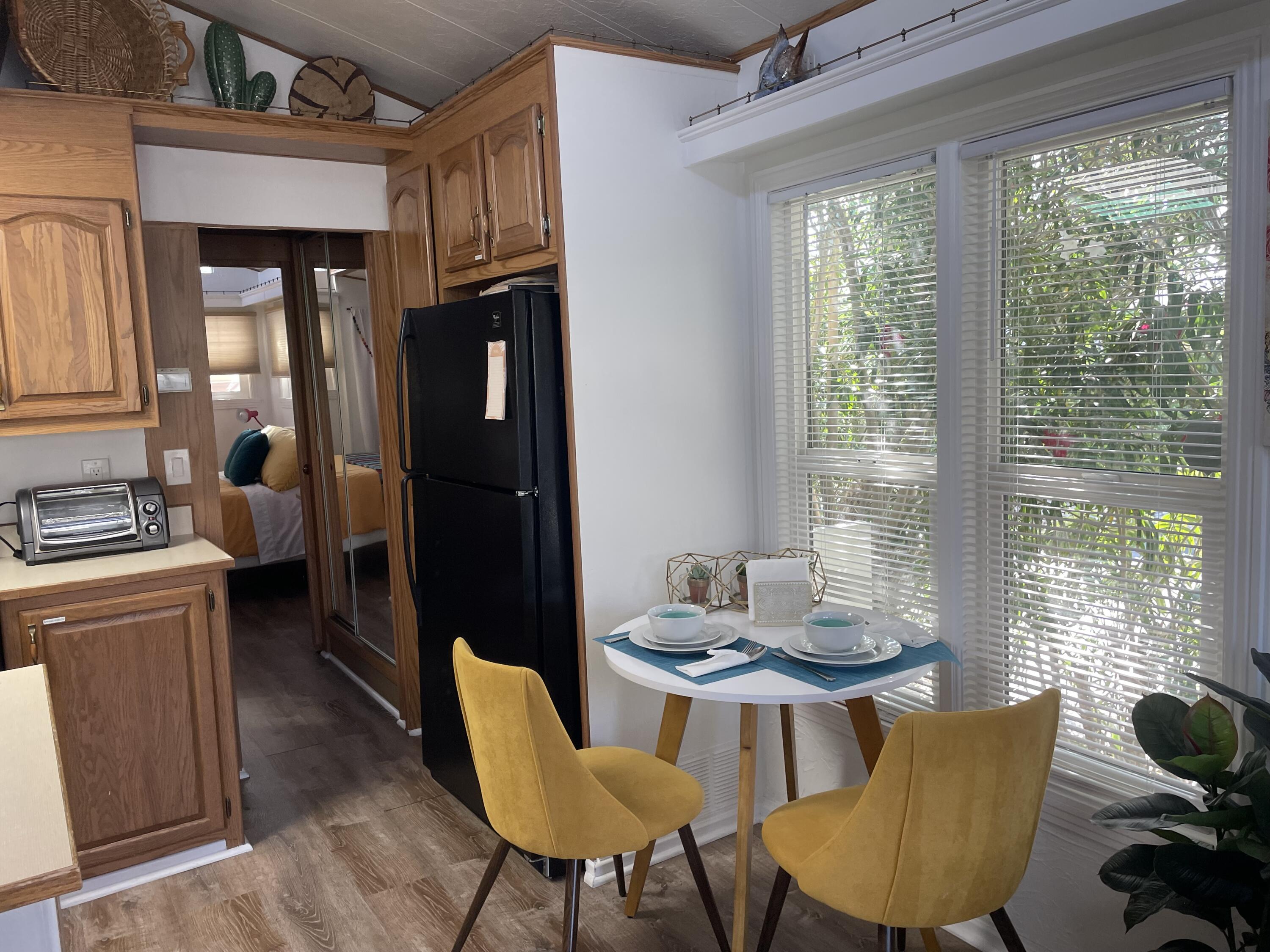 74711 Dillon Road, Unit 711 Desert Hot Springs, CA 92241 - Photo 4 of 35 a view of a dining room with furniture window and outside view