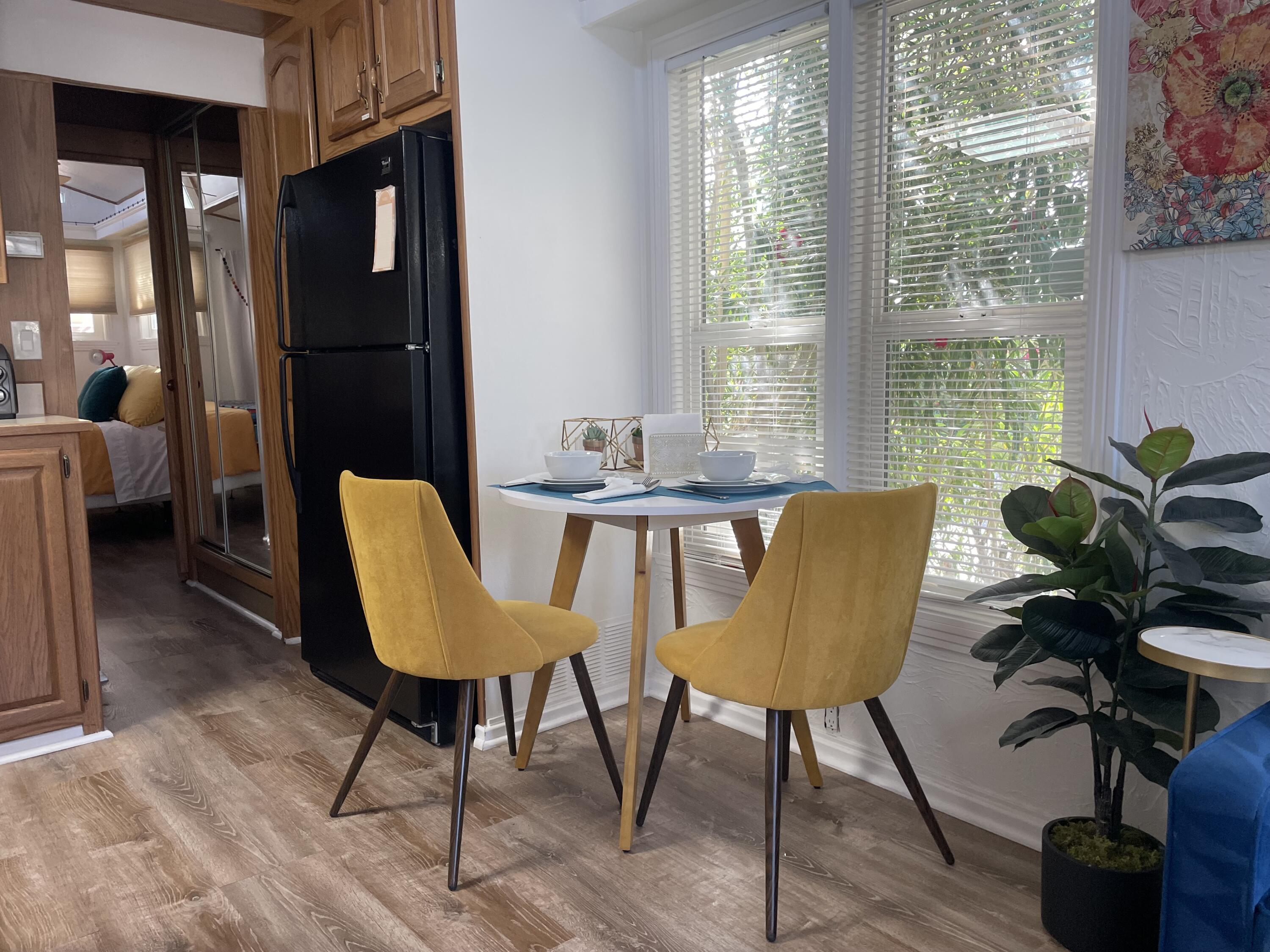 74711 Dillon Road, Unit 711 Desert Hot Springs, CA 92241 - Photo 5 of 35 a view of a livingroom with furniture and a potted plant