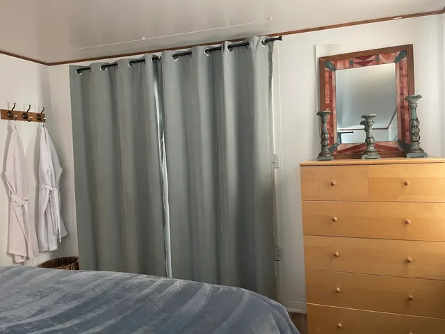 a view of a bathroom with tub and sink