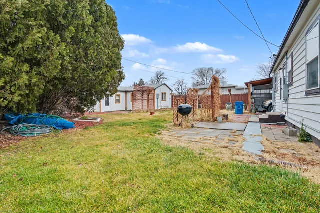 a view of a backyard of the house