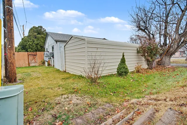 a view of a car park in front of house