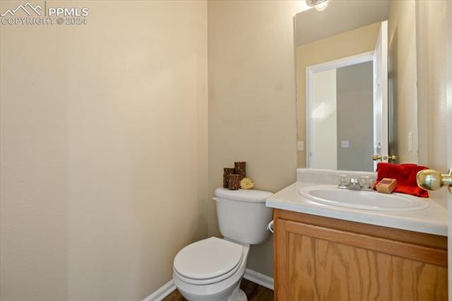7655 Coffee Road Peyton, CO 80831 - Photo 10 of 31 Main level half bath