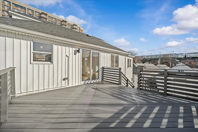 a view of a balcony with wooden floor
