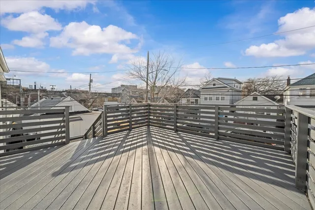 a view of a balcony with wooden floor