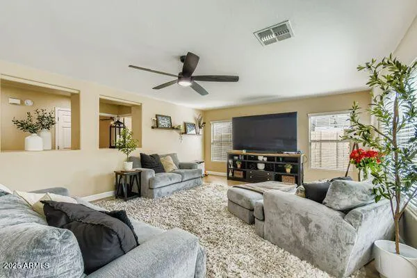 a living room with furniture and a large window