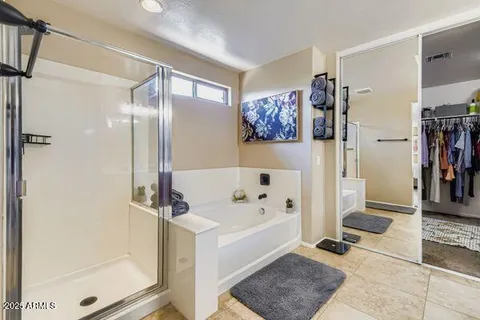 a en suite bathroom with double sink and a mirror