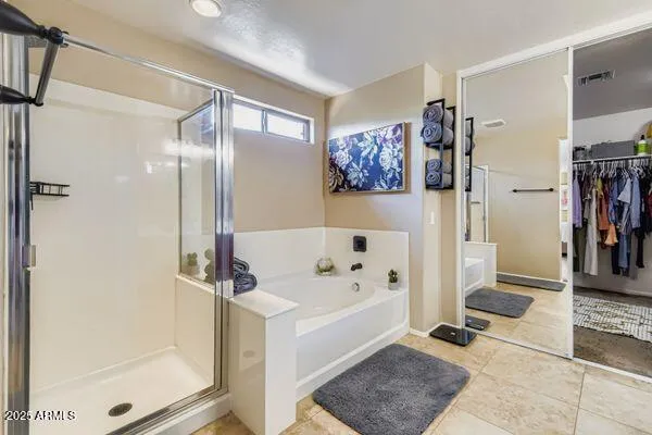 a en suite bathroom with double sink and a mirror