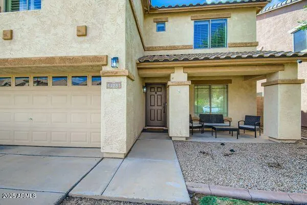 a living room with furniture and a dining table with wooden floor