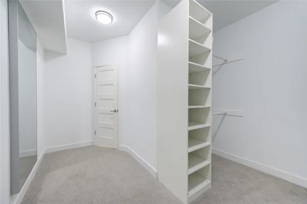 a view of an empty walk in closet