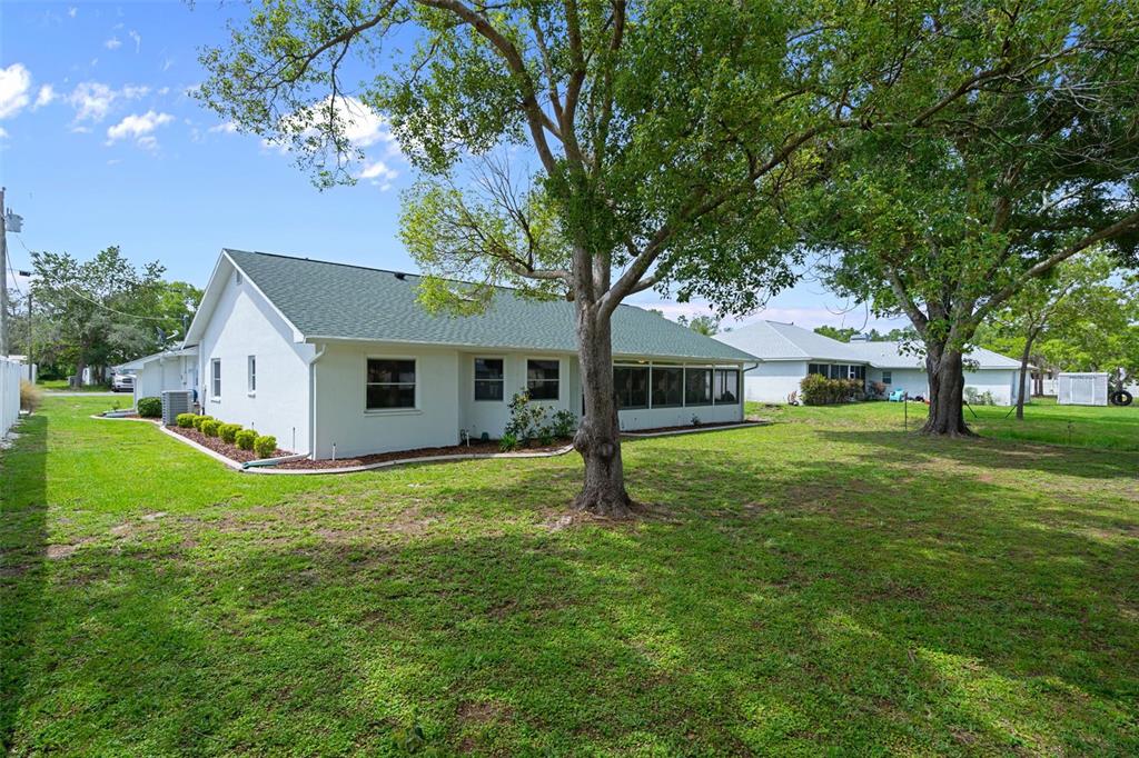 5035 Harbinger Road Spring Hill, FL 34608 - Photo 46 of 47 a front view of a house with a garden