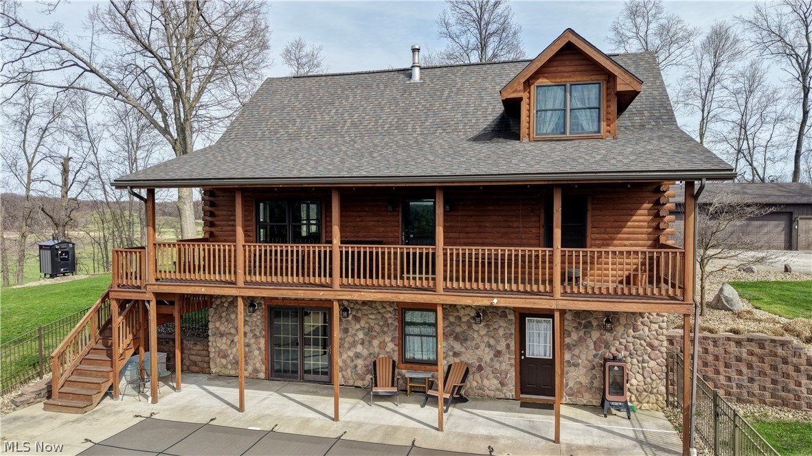 8045 McFadden Road Shreve, OH 44676 - Photo 6 of 45 Rear view of property with log siding, a patio area, stone siding, and roof with shingles