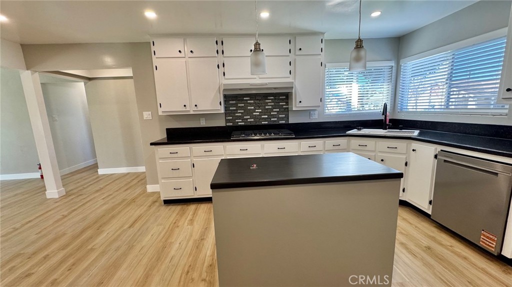 2304 Workman Avenue Simi Valley, CA 93063 - Photo 2 of 6 a kitchen with a sink a stove a refrigerator and cabinets