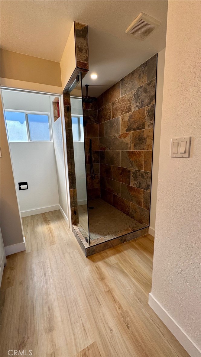 2304 Workman Avenue Simi Valley, CA 93063 - Photo 5 of 6 a bathroom with a glass shower door