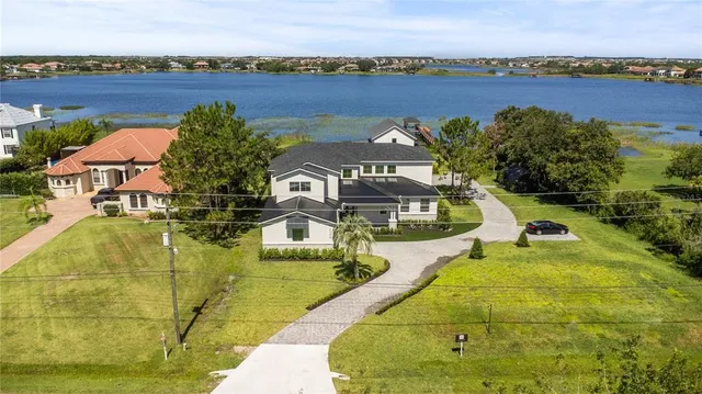 swimming pool view with a lake view