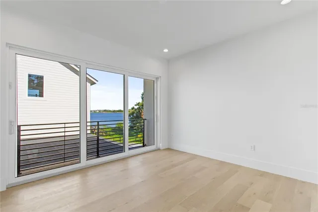 a view of a room with furniture and windows
