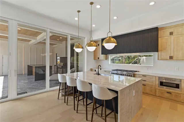 a kitchen with a table and chairs in it