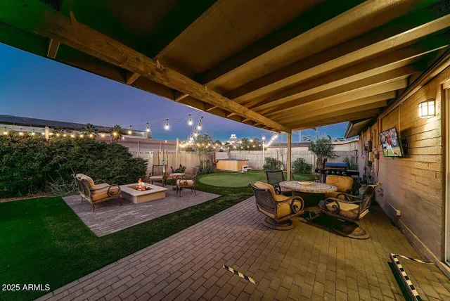 a view of a tables and chairs in patio