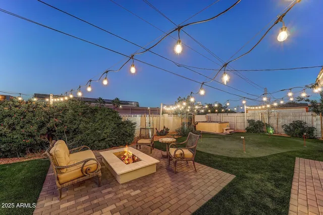 a view of a patio with table and chairs and wooden floor